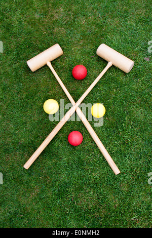 A croquet Set laid out on the grass ready for play Stock Photo
