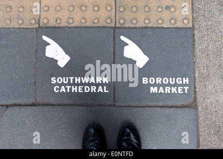 Tiled directions to Southwark Cathedral & Borough Market embedded into the pavement of Southwark Street, London, England, UK Stock Photo