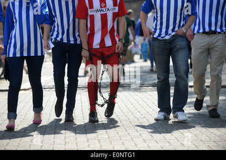 A group of men (and some ladies) on a Stag Do in East Street, Brighton, East Sussex, UK. Stock Photo