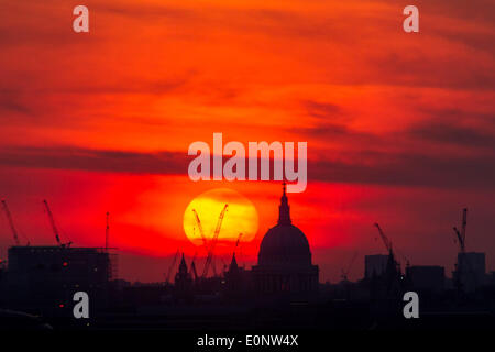 London, UK. 17th May, 2014. Dramatic sunset over St. Paul's Cathedral in London Credit:  Guy Corbishley/Alamy Live News Stock Photo