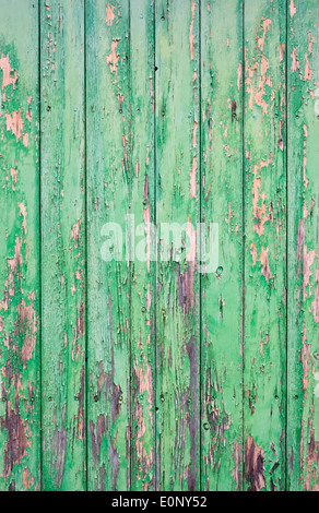 Shabby but charming wooden door with flaked green paint for background, texture or wall. Found in Majorca, Islas Baleares, Spain Stock Photo