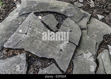 Broken gravestone Stock Photo