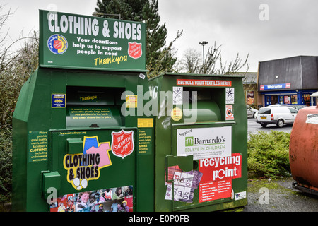 Clothing charity recycling collection bins in Hawick, Scotland. Stock Photo