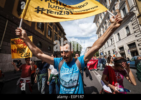 Rome, Italy. 17th May, 2014. Protesters shout slogans and hold banners during a nationwide demonstration against the privatization of the commons and the austerity policies to deal with the economic crisis in Rome, Italy, Saturday, May 17, 2014. Thousands protesters took part at a nationwide demonstration in Rome against the privatization of the commons, against the government’s plans to reform job market and to call for social rights and democracy in Italy and Europe.  Credit:  Giuseppe Ciccia/Pacific Press/Alamy Live News Stock Photo