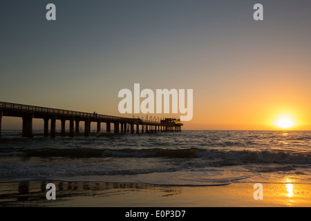 Sunset over Swakopmund Jetty and Atlantic ocean Stock Photo