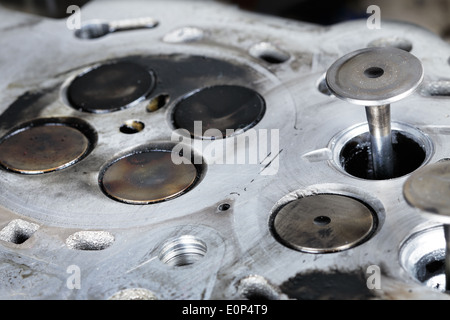 Worn out engine head with four valves per cylinder Stock Photo