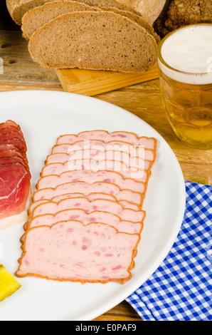 Cold meat, pickles, whole wheat bread and beer, a traditional German cold meal Stock Photo