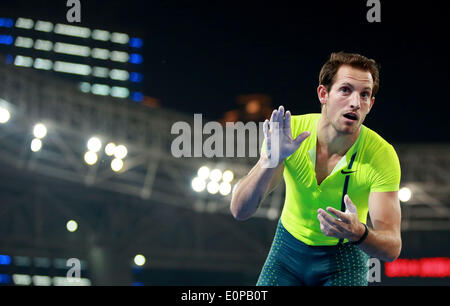 Shanghai, China. 18th May, 2014. Renaud Lavillenie of France celebrates during the men's pole vault at the IAAF Diamond League Athletics in Shanghai, east China, May 18, 2014. Lavillenie claimed the title with 5.92 meters. © Li Ming/Xinhua/Alamy Live News Stock Photo