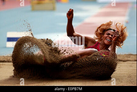 Shanghai, China. 18th May, 2014. Blessing Okagbare of Nigeria competes during the women's long jump at the IAAF Diamond League Athletics in Shanghai, east China, May 18, 2014. Okagbare claimed the title with 6.86 meters. © Li Ming/Xinhua/Alamy Live News Stock Photo