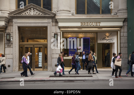 People walking along 5th Avenue in NYC one of the best known