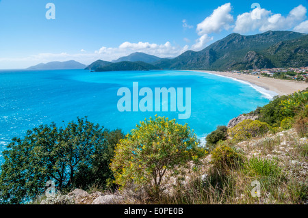 The exquisite turquoise blue Aegean Sea seen from above which shows the beach at the town of Oludeniz near Fethiye in Turkey