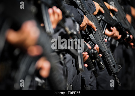 Members of the specialized Police anti-gang unit pose for pictures before leaving for an operation in San Salvador, El Salvador. Stock Photo