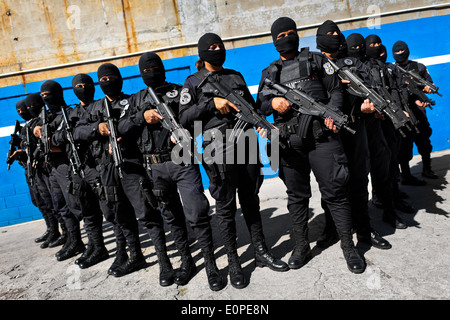 Members of the specialized Police anti-gang unit pose for pictures before leaving for an operation in San Salvador, El Salvador. Stock Photo