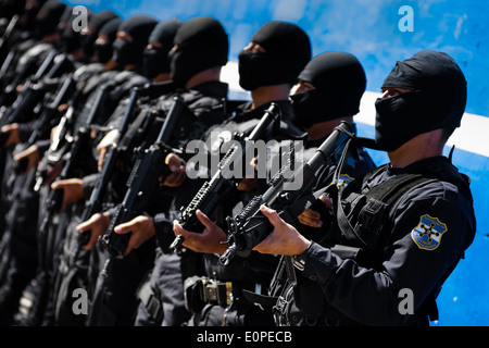 Members of the specialized Police anti-gang unit pose for pictures before leaving for an operation in San Salvador, El Salvador. Stock Photo