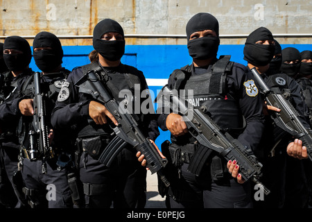 Members of the specialized Police anti-gang unit pose for pictures before leaving for an operation in San Salvador, El Salvador. Stock Photo