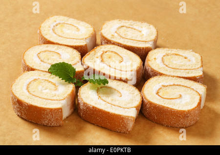 Slices of sponge cake roll with cream filling Stock Photo