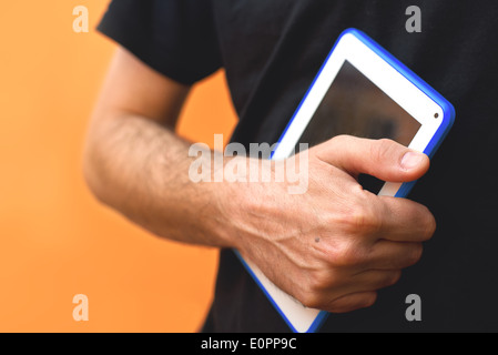 Male Hands with tablet computer. Using modern technology gadgets. Stock Photo