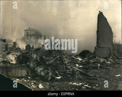 Nov. 11, 1956 - Italian plane crashes near Orly-32 killed: A DC-6 Rome-New York plane crashed near Orly shortly after taking off last night. 32 people were killed and 2 badly injured. Picture taken early this morning showing the wreckage and part of the wall (right), all that remains of the house on which the plane crashed. Stock Photo