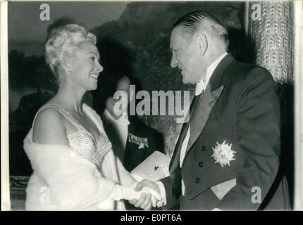 Feb. 02, 1957 - Screen and Stage Stars received at Elysee Place: For the first time in the Elysee Palace history, screen and stage actors were guests of President Coty at the reception in honour of State Ministers and Officials yesterday. Photo Shows President Coty welcomes Martine. Stock Photo