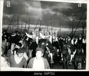 Feb. 02, 1957 - Queen Visits Bull Farm - Vila Franca - Portugal. Photo shows Scene during the Queen's visit to the Bull Farm, Vila Franca, Portugal - showing some of the mounted ''Campinos'' - who waves their long poles in greeting. Stock Photo