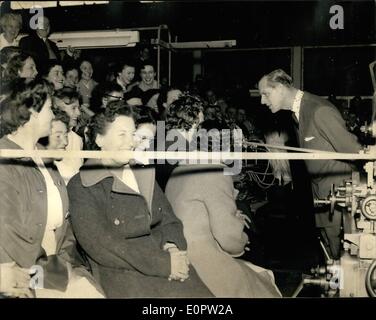 Mar. 03, 1957 - H.M. The Queen And The Duke Of Edinburgh, Visit The Atomic Energy Establishment At Harwell: H.R.H. the Duke of Edinburgh stops to chat with some of the women workers in the main workshop. Stock Photo