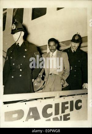 Jan. 01, 1957 - ''The Convict No Prison Can Hold'' Arrives In Britain: 36-years old George Leroy Matthews, who is known as the convict no prison can hold - arrived at Plymouth yesterday in the liner Reina del Pacifico. Matthews, a ethnic burgler, has been sent to Britain by the Bermuda authorities to complete a ten years sentenced imposed in 1949. He escaped five times from Hamilton, Bermuda, goal and three times from a New York goal. Photo shows George Leroy Matthews, is escorted from the liner by two policemen, after his arrival at Plymouth yesterday. Stock Photo