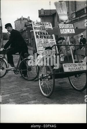 Apr. 04, 1957 - Free Ride: Postmen of Chaville, A Small town near Paris, took part in a walking contest this morning. Photo Shows One of the 'Trailers' who gave up in being a free ride on the 'woe to the Vanquished Chariot' Stock Photo