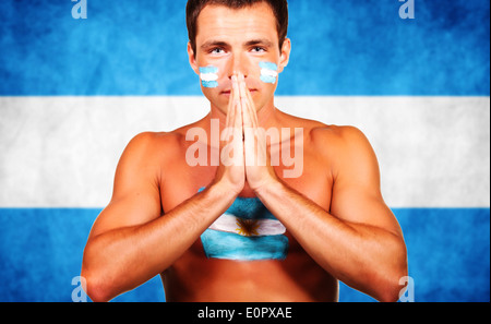 Cheering argentinian soccer fan over argentina flag background Stock Photo