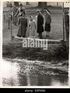 Apr. 25, 1957 - Royal Family Watch The Horse Trials At Badminton: The Queen, the Duke of Edinburgh, the Queen Mother and Princess Margaret watched the dressage tests in the Badminton Horse-Trials today. They are guests of Duke and Duchess of Beaufort at Badminton, Gloucestershire, until Saturday. Photo Shows .M. Queen stands beside the Duke of Beaufort as they examine one of the water jumps. Stock Photo