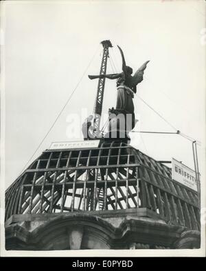 Jul. 02, 1957 - Work commences on removing the Unknown'' figure form the Ancient Gaiety Theatre: Work started this morning on the removal of the figure which greased the dome on the old Gaiety Theatre in the Strand. Origin of the figure is unknown. The Theatre is being demolished to make way for a new office block. In memory of the famous Theatre-It is hoped that the figure can be renovated and placed in the centre court of the new building. Photo shows Workmen secure the figure with ropes-after the removal had to be suspended because things were not progressing satisfactorily-this morning. Stock Photo