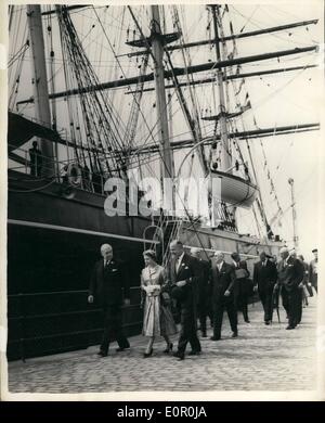 Jun. 06, 1957 - H.M. The Queen Opens the ''Cutty Sark'' to the Public on tour of inspection.: H.M. The Queen this afternoon went to Greenwich - where she opened the renovated Clipper ''Cutty Sark'' to the public. The vessels has been installed in a specially constructed dry dock for preservation. Photo shows H.M. The Queen walks around the outside of the vessel- after having performed the opening ceremony this afternoon. Stock Photo