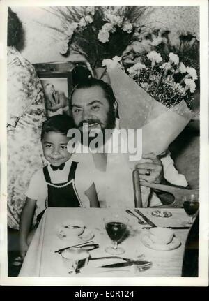 Aug. 08, 1957 - Ernest Borgnine on Holiday in Italy. The famous Italo American film star Ernest Borgnine, who won an ''Oscar'' in 1955 for his role in the film ''Marty'' - pictured Carpi, (Modena, North Italy), with one of his young relatives - during his Italian holiday, at the home of his father. Stock Photo