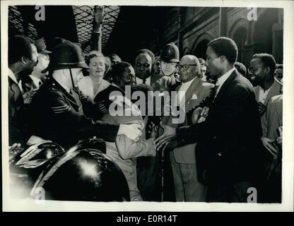 Jun. 06, 1957 - Enthusiastic Welcome When Prime Minister of Ghana arrives in London. Dr. Kwame Nkrumah, the Prime Minister of Ghana, who is attend the Commonwealth Prime Ministers Conference in London, arrived in London this evening from Liverpool. Photo shows Dr. Kwame Nkrumah was given an enthusiastic welcome when he arrived at Euston the evening, and police are seen as they make a passage for him as he went to his car. Dr. Nkrumah is seen in centre of picture - full face. Stock Photo