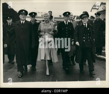 Sep. 09, 1957 - Jayne Mansfield arrives: Hollywood film star Jayne Mansfield arrived at London Airport today. She is to attend tomorrow's premiere of her film ''Oh for a man''. Photo Shows Jayne Mansfield is escorted from the aircraft by police, when she arrived at London Airport today. Stock Photo