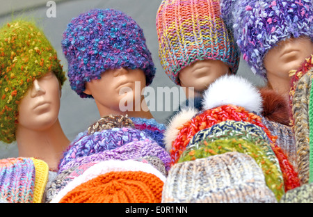 Colorful hand knitted hats on street sale Stock Photo