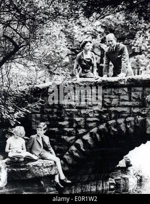 Queen Elizabeth II with her husband Prince Philip and their children at the creek Stock Photo