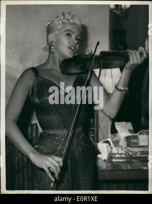 Sep. 09, 1957 - JAYNE MANSFIELD PLAYS THE VIOLIN IN ITV'S PROGRAMME ''SUNDAY NIGHT AT PALLADIUM'': Jayne Mansfield appeared on ITV last night with a G string- but she wasn't wearing it. The G starring was on the violin she played in the TV Programme ''Sunday Night at the Palladium''. Jayne appeared against doctor's orders and when the show ended she was rushed back to bed. Photo Shows This is how the TV viewers saw Jayne with her violin last night. Stock Photo