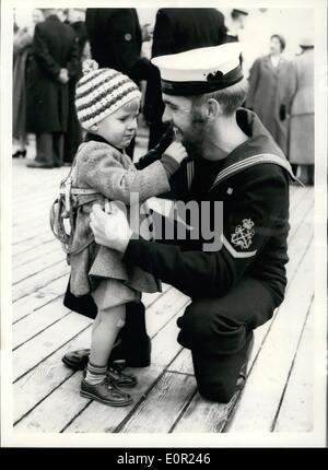 Oct. 10, 1957 - British nuclear test ship returns to the U.K. The petty officer gets his beard pulled. The tank Landing ship Narvik arrived back at Chatham this morning - after taking part in operation grapple the British nuclear tests in the Christmas Islands. H.M.S Narvik has been associated with more atomic tests than any other British ship. Photo shows Derick Williams (Acting petty Officer) of Acton - has his beard Pulled by his 2 year old nephew Graham Gowler -at Chatham today. Stock Photo