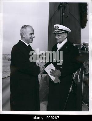 Dec. 12, 1957 - The Navy Certificate of Merit, for ''significant achievement'' in connection with the design and construction of the USS Nautilus, world's first atomic powered submarine, was presented to General Dynamic's Corporation's Electric Boat Division at Groton, Conn. Rear Admiral Milton E. Miles, Commandant, Third Naval District, makes the first presentation of the award to Carleton Shugg, Dynamics senior vice president. Award was given at commissioning of third A-sub Skate, seven months ahead of schedule. Stock Photo