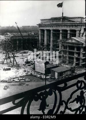 Dec. 12, 1957 - Berlin's Brandenburter Tor Is Nearing Completion: Berlin's landmark is almost completes the damage it suffered during the war and the workers will celebrate this occasion after 10 months of work, on Dec. 14, 1957. The Scaffolding are the gate will be taken own and vehicles will be able to pass. The work was payed by the East-Zone of Berlin and the sum used up to now is 2 Million German ,arks, The quadriga with the Victoria will be made in Western-Berlin and is supposed to be replace on the top of the gate approx August 1958. Stock Photo