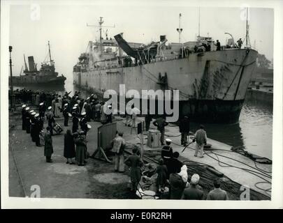 Oct. 10, 1957 - British Nuclear Test Ship Returns To Te United Kingdom. Arriving At Chatham: After tak9ng part in Operation Grapple - the British Nuclear tests in the Christmas Islands - the Tank Landing Craft H.M.S. arrived back at Chatham this morning. The vessel has taken part in more tests than any other British Ship.Photo Shows The scene says the vessel arrives at Chatham today - greets by a Marine band from the quayside. Stock Photo