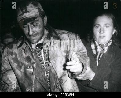 Nov. 11, 1957 - Miners saved after buried in mine for 120 hours. After being trapped in their mine for over 120 hours the two miners Richard Kayl (49) and Anton Plihal 24, were saved this morning through a 40 cm digging hole. Photo shows Mr. Anton Plihal with his sister. Stock Photo