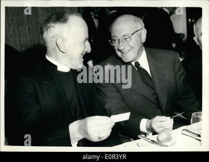 Nov. 11, 1957 - Foyles Literary Luncheon In Honour of Cecil B. DeMille. A luncheon given by Foyles in honour of Cecil B. DeMille to mark the production of his new film ''The Ten Commandments'' was held at the Dorchester Hotel. Photo Shows: Cecil B. DeMille is seen chatting with Rev. Sherard Falkner Allison, the Bishop of Chelmsford. Stock Photo