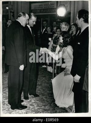 Mar. 03, 1958 - Prince Philip meets Anne Hayward. Attends first night of ''Violent Playground''.: Prince Philip was the guest of honour at the First Night of the film ''Violent Playground'' - at the Odeon Theatre, Marble Arch. Photo shows Star of the film Anne Hayward - shakes hands with Prince Philip - before start of the film last evening. Stock Photo