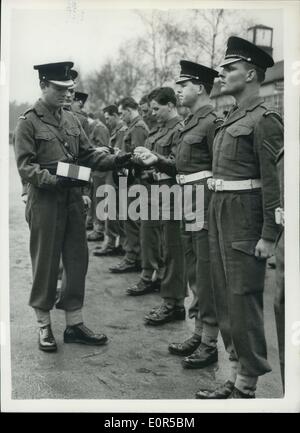 Mar. 01, 1958 - ST. DAVID'S DAY CELEBRATIONS: The 1st.Battalion Welsh Guards today celebrated St. David's Day at Pirbright Camp, Brookwood, Surrey. Major General J.I.R.Moore, CB, CBE., DSO, General Officer Commanding Household Brigade, presented leeks to the Battalion on a parade. Keystone Photo Shows:- Major P.de Zulueta, Commander of No.2 Company, hands out leeks at Pirbright camp today. Stock Photo