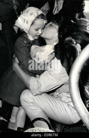 Apr. 04, 1958 - Juliette Greco: Back from Africa: Juliette Greco who is starring in ''Racines Du Ciel'' (The Roots of Heaven) just completed in Equatorial Africa arrived at Orly Airport this morning. Photo Shows Juliette Greco kissing her little daughter after alighting from the plane this morning. Stock Photo