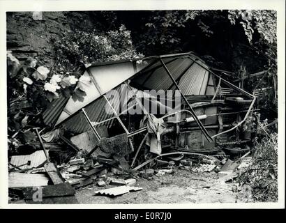 Jul. 04, 1958 - Car and Garage washed away in the sheffield floods: Photo Shows A Garage and car after it had been washed 200 yards from its mooring at Moscow cottages, Abbeydale, Sheffield during the heavy floods which covered vast areas following the heavy rains. Stock Photo