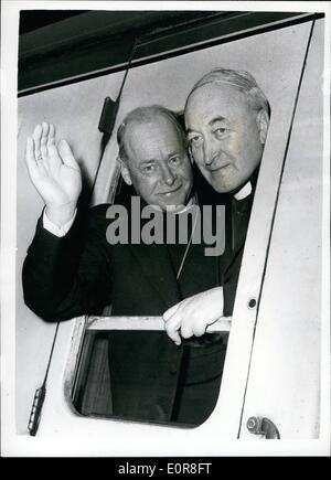 Jul. 07, 1958 - Special trains take Bishops to Canterbury for opening service of the Lambeth COmference. Two special trains left Victoria station this morning to take bishops from all over the world to canterbury for the opening service of the Lambeth Conference which will be held in Canterbury cathedral. Photo shows Bishop Stanistreet , Bishop of Killaloe. Ireland , (left) and Bishop McCann,Bishop of Meath , Ireland seen as they left Victoria by special train this morning. Stock Photo