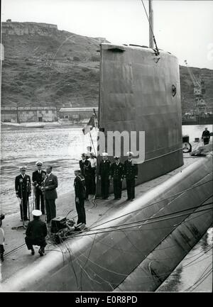 Aug. 08, 1958 - Harbour on the arrival of the Nautilus yesterday. Members of the crew line the decks. Britain Welcomes the Nautilus; The United States nuclear powered submarine Nautilus was given a big welcome when she arrived at Portland, Dorset yesterday - the first port of call following her historic journey which took her under the North Pole. Photo Shows the scene aboard the Nautilus during the speech by the American Ambassador, Mr. John Hay Whitney. On his right is the submarine's captain, Commander Anderson. Stock Photo