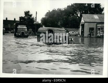 Sep. 09, 1958 - Flood waters-eight feet deep in streets of Wickford;Essex: One part of the Essex town of Wickford was eight feet deep in water early today-following the heavy rains which caused the River Crouch to burst its banks for the fifth time this year.. Photo shows A motor van makes its way through the flood waters at Wickford Essex today. Stock Photo